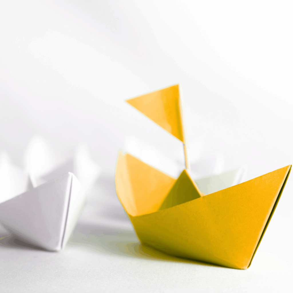 tellow paper boat guiding other boats representing GUIDE THE DECISION: WHY BUYERS NEED CLARITY, NOT REMINDERS—AND HOW JANUARY 15 CHANGES EVERYTHING