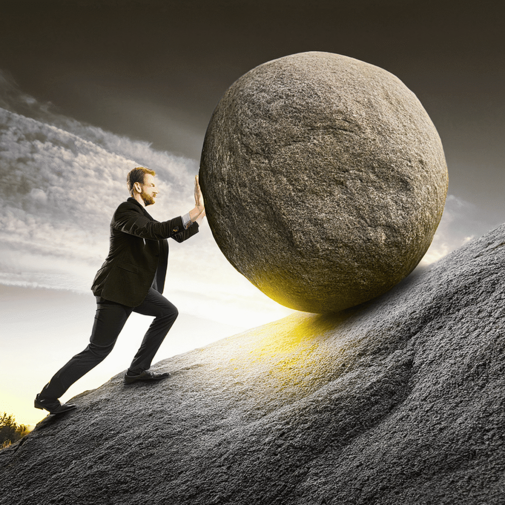 man pushing boulder up a hill